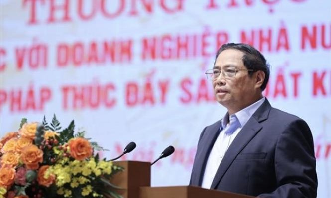 越南政府总理范明政主持政府常务委员会与全国国有企业会议