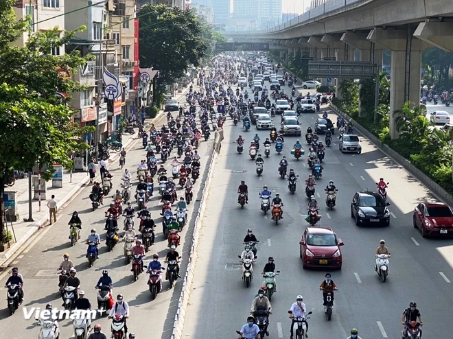 Lượng xe máy người dân sử dụng vẫn là phương tiện giao thông chính tại nhiều thành phố lớn ở nước ta. (Ảnh: Việt Hùng/Vietnam+)