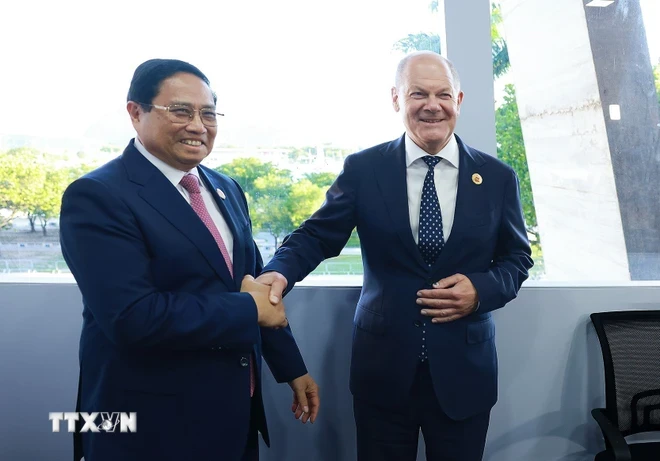 Thủ tướng Phạm Minh Chính gặp Thủ tướng Đức Olaf Scholz tại Hội nghị thượng đỉnh G20. (Ảnh: Dương Giang/TTXVN)