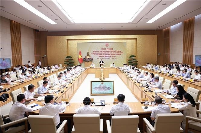 第18-NQ/TW号决议三年实施情况及2024年《土地法》一年执行成效总结会议现场。图自越通社