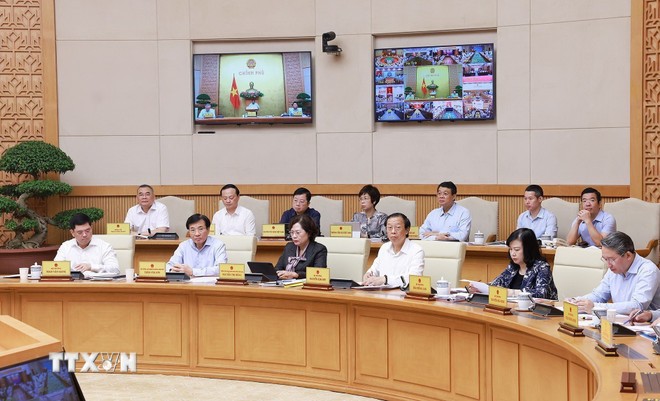 Đại diện các bộ, cơ quan thuộc Chính phủ tham dự phiên họp. (Ảnh: Dương Giang/TTXVN)