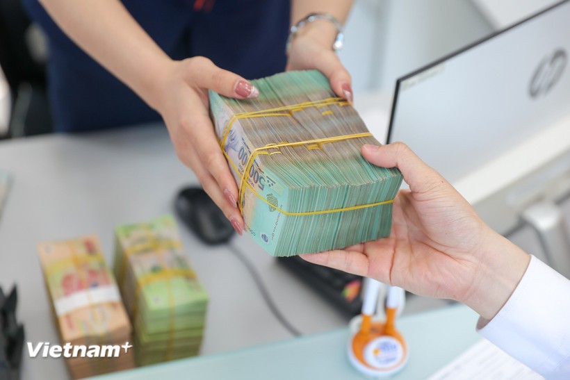 Ngân hàng nhận chuyển giao bắt buộc được giảm 50% tỷ lệ dự trữ bắt buộc. (Ảnh: Vietnam+)